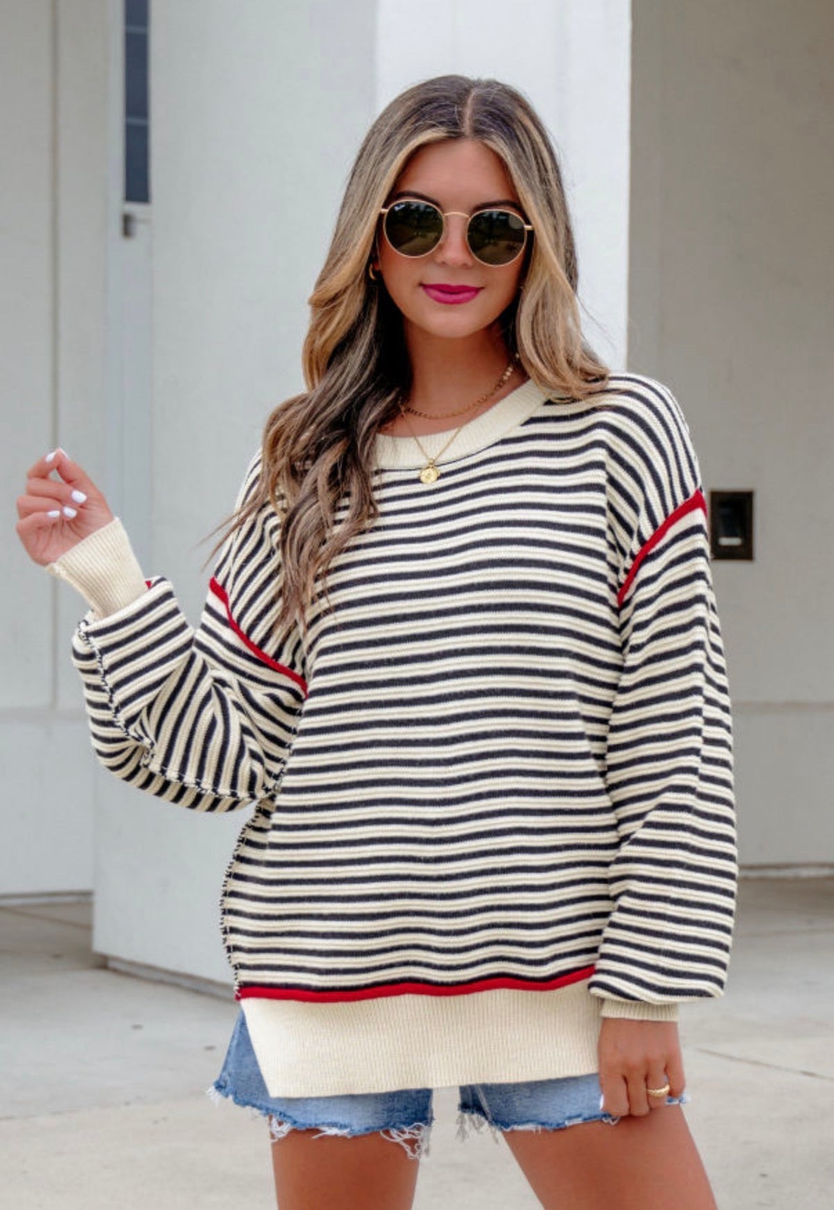 Cream and Black sweater with Red Trim