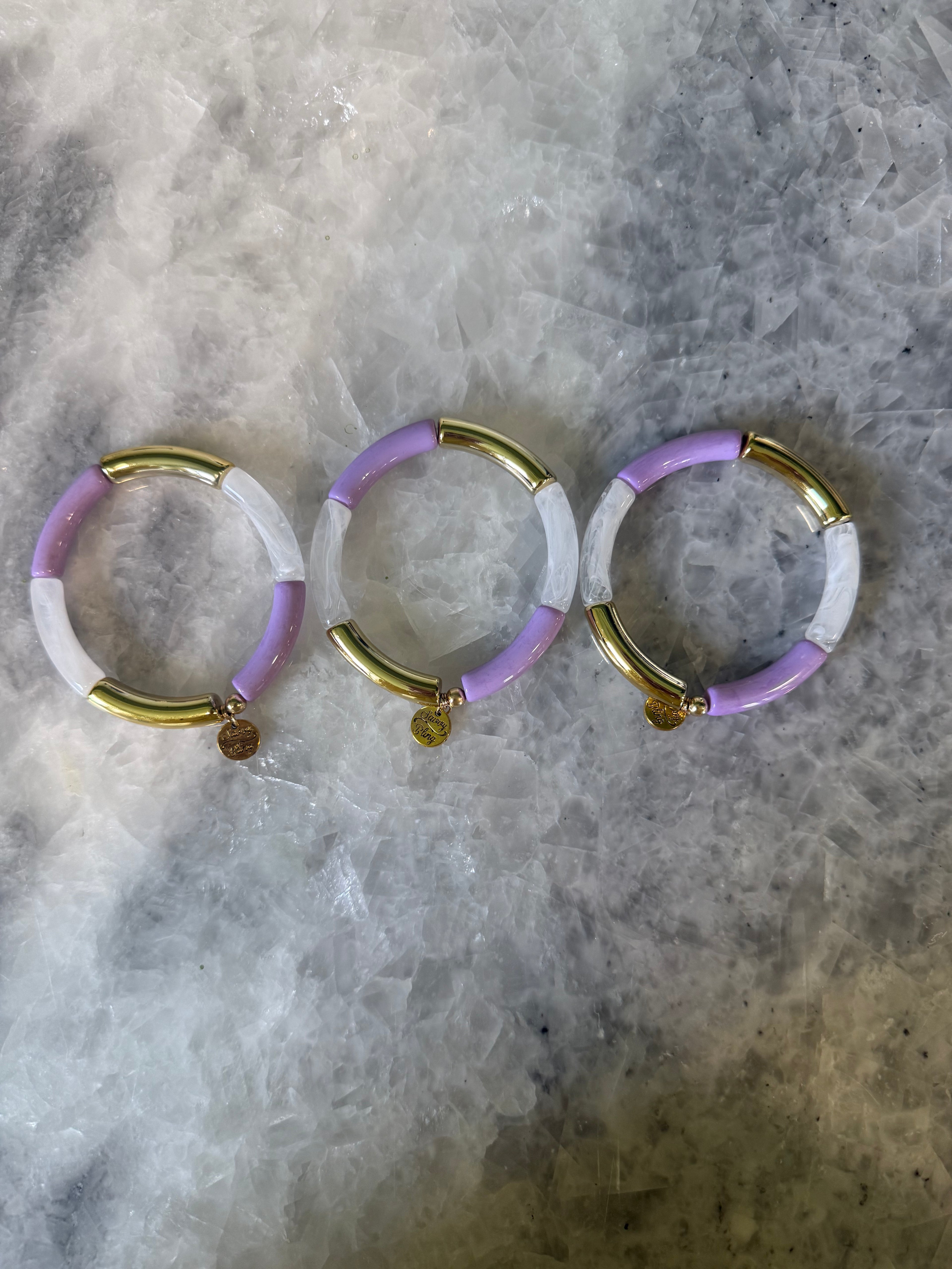 Purple, White, and Gold Bracelets