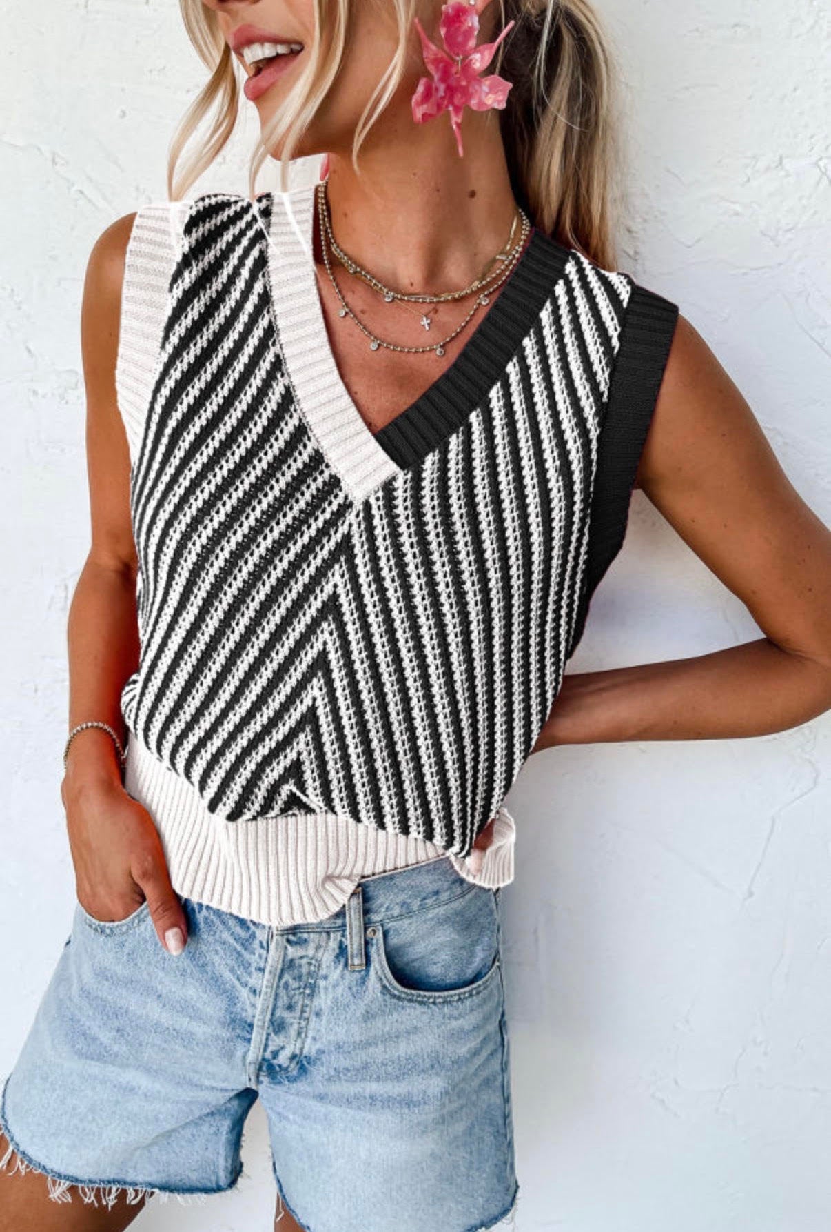 Black and white sleeveless sweater